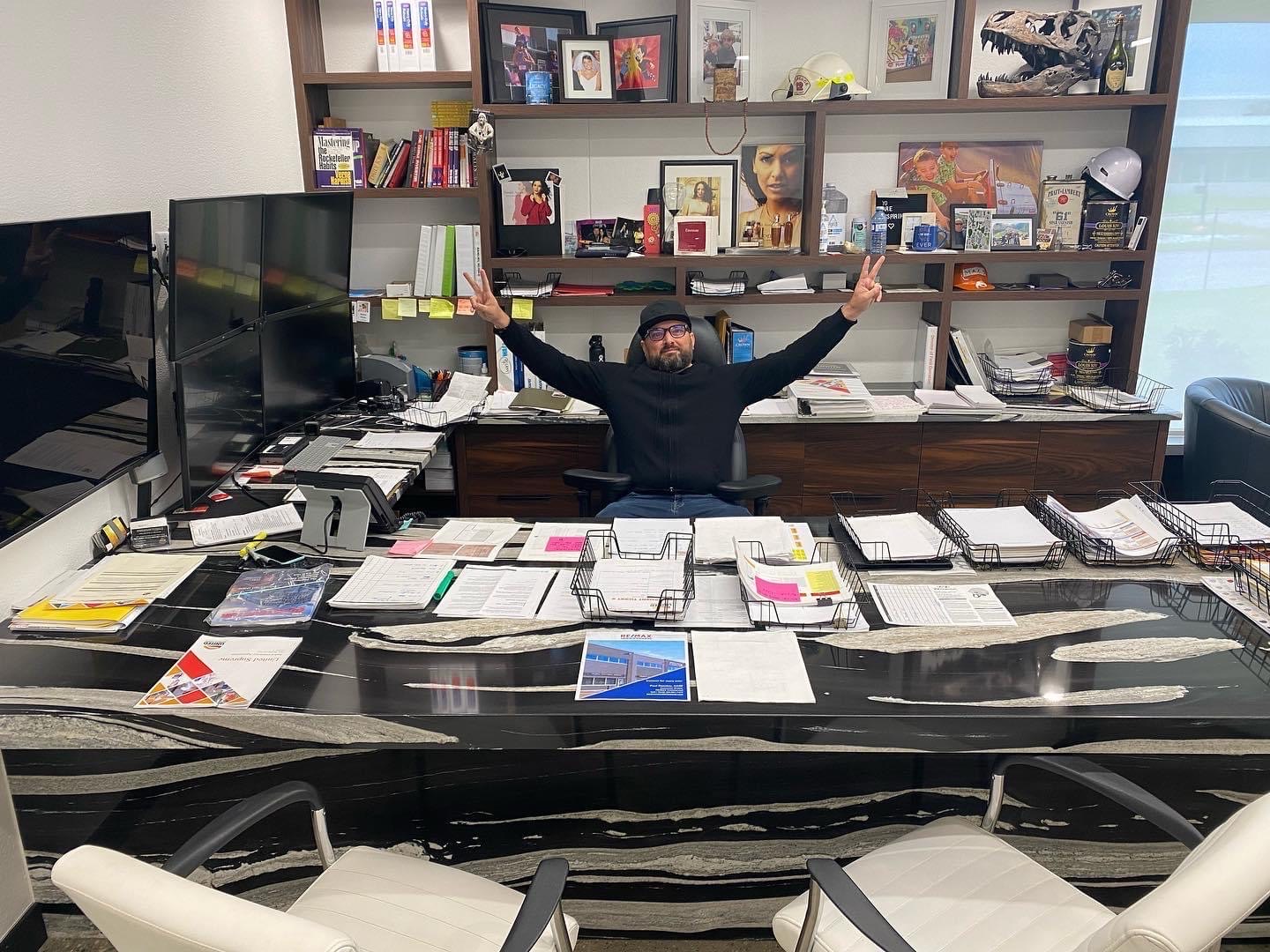 Danijel Slisko celebrating at his desk